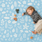 Baby playing on PopsyKosy Tranquil Flower Ocean Blue EVA foam mat in modern living room
